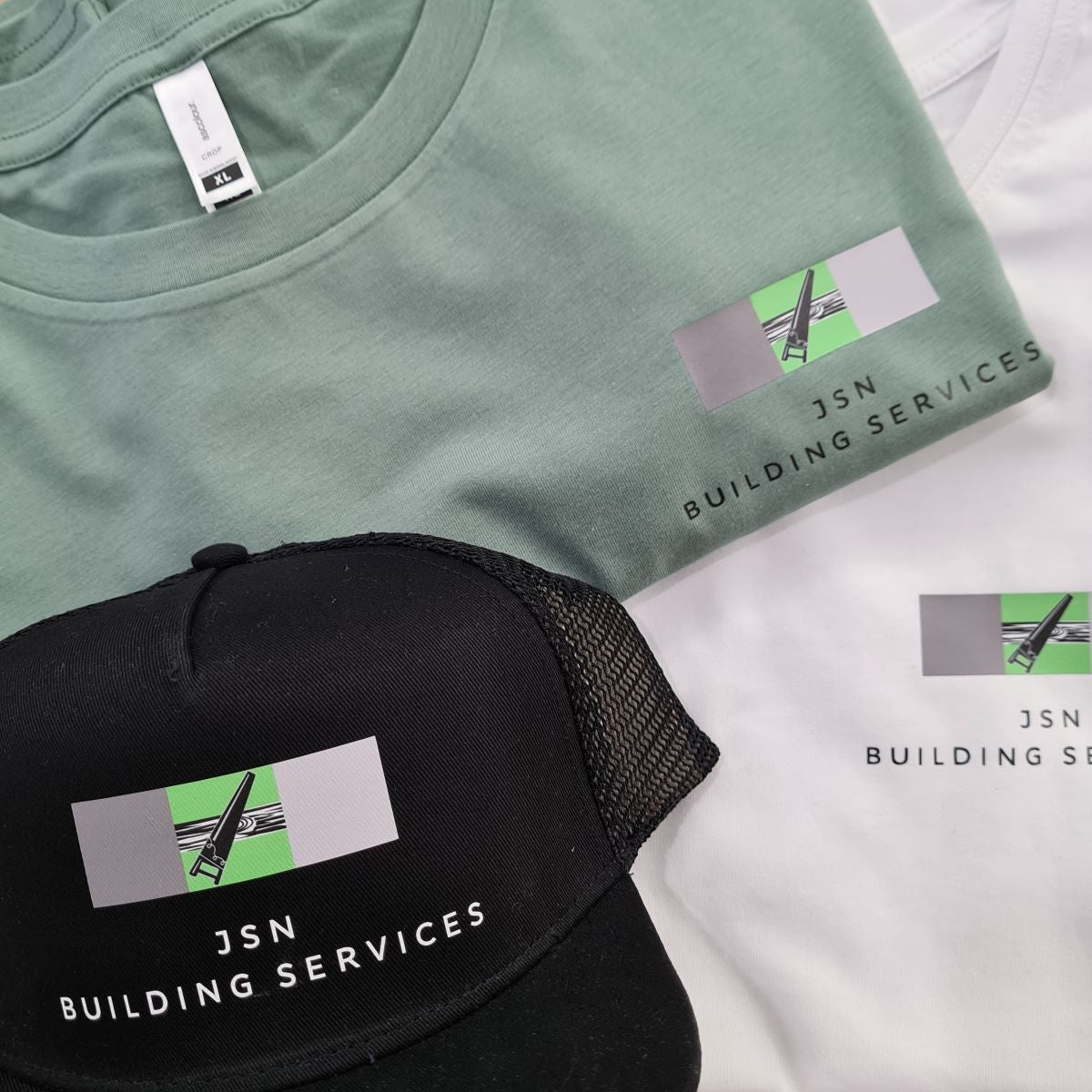 Printed logos on hat and shirts for JSN Building Services