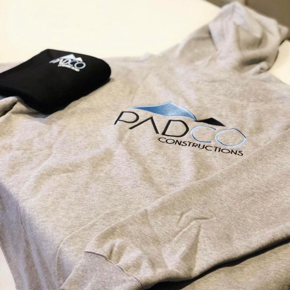 Embroidery on hoodie and beanie for Padco Constructions